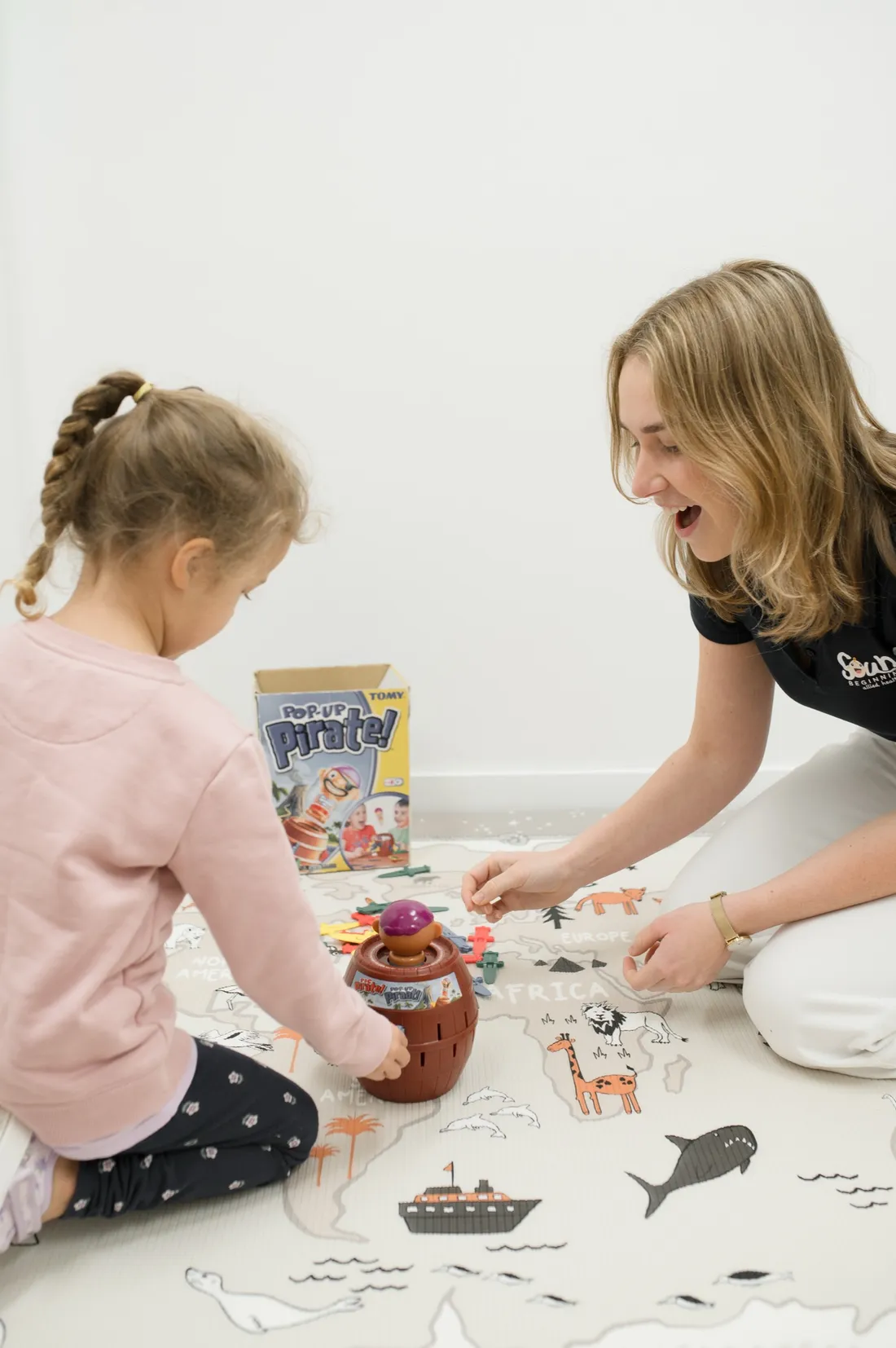 A Sound Beginnings speech pathologist playing a game with a young child during a therapy session